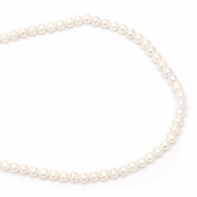 Наниз мъниста естествена перла 6~7 мм дупка 0.8 мм клас АА цвят крем ~64 броя