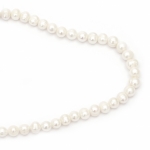 Наниз мъниста естествена перла 10~11 мм дупка 1 мм клас А цвят крем ~38 броя