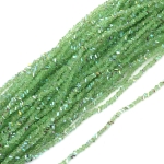 Наниз от кристални мъниста 3x4x3 мм дупка 1 мм фасетиран прозрачен с AB покритие цвят светло зелен дъга ~130 броя