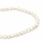 Наниз мъниста естествена перла 12~13 мм дупка 1 мм клас А цвят крем ~31 броя