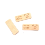 Етикет от мек велур 40x1.5 мм с надпис Handмade мече цвят шампанско -10 броя